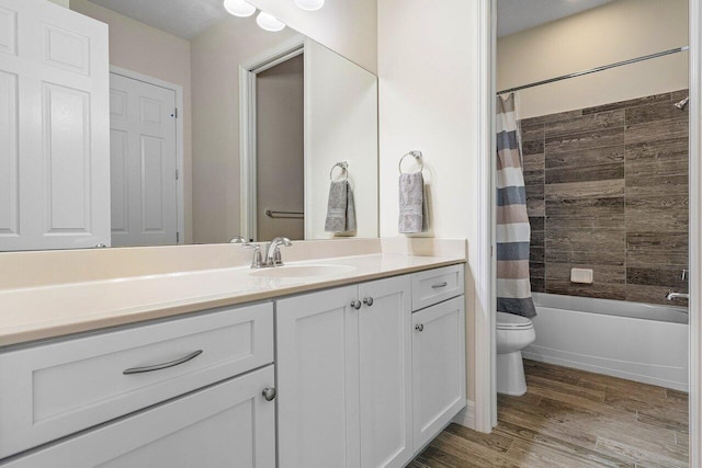 full bathroom featuring shower / bath combo, toilet, wood-type flooring, and vanity