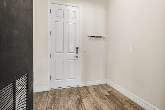 doorway to outside featuring wood-type flooring