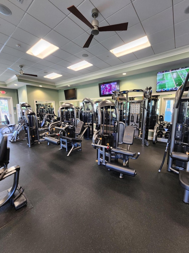 gym featuring a drop ceiling and ceiling fan