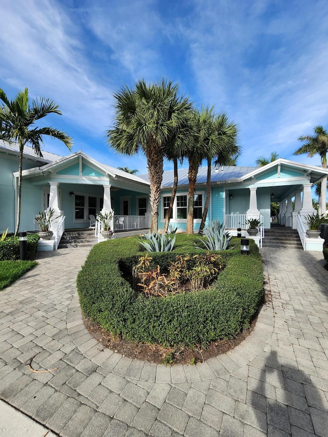 view of front of home featuring a carport