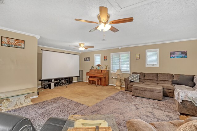 living room featuring hardwood / wood-style flooring, ceiling fan, crown molding, and a textured ceiling