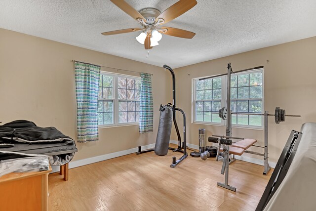 bedroom with wood-type flooring and a textured ceiling