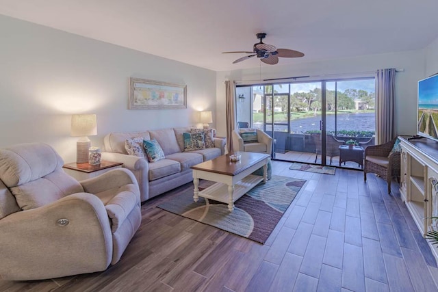 living room with hardwood / wood-style flooring and ceiling fan