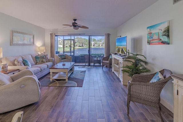 living room with ceiling fan and hardwood / wood-style flooring