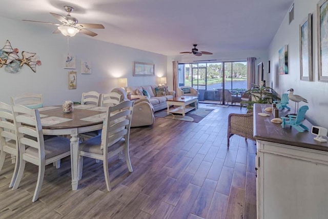 dining space with ceiling fan and hardwood / wood-style flooring