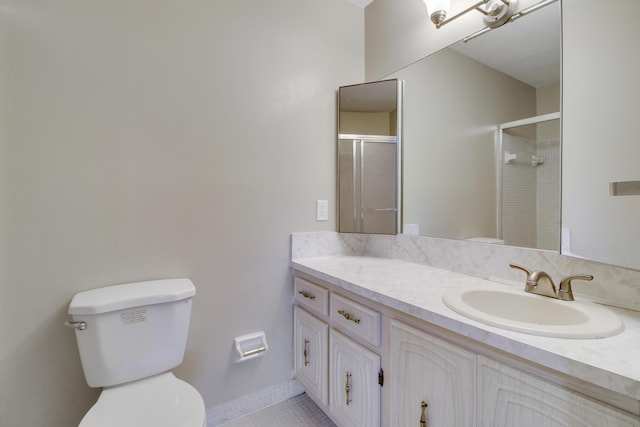 bathroom featuring tile patterned flooring, a shower with door, vanity, and toilet