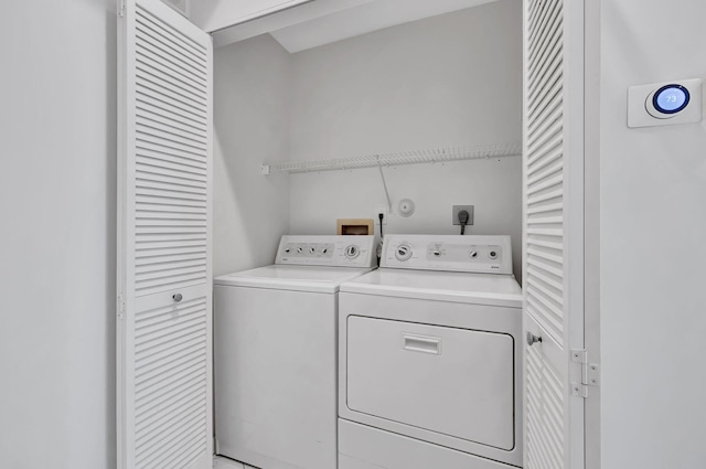 washroom with washer and clothes dryer