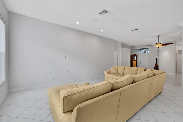 living room with light tile patterned flooring and ceiling fan