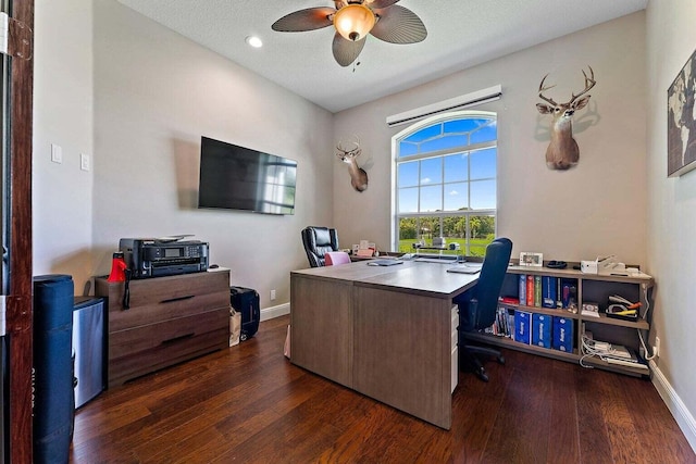 office area with ceiling fan, a textured ceiling, and dark hardwood / wood-style floors