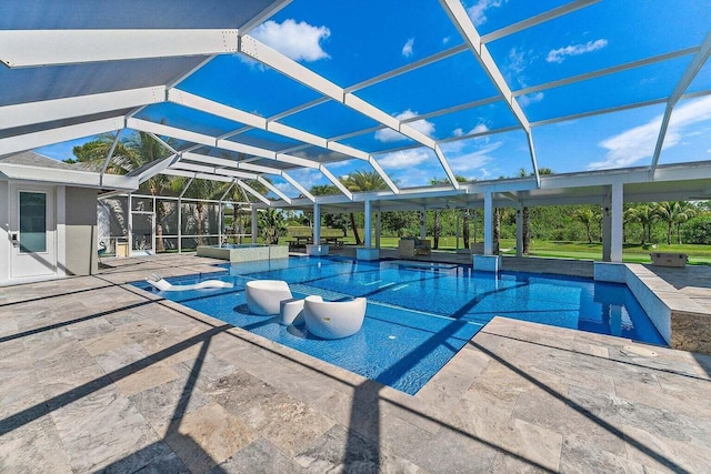 view of swimming pool featuring glass enclosure and a patio