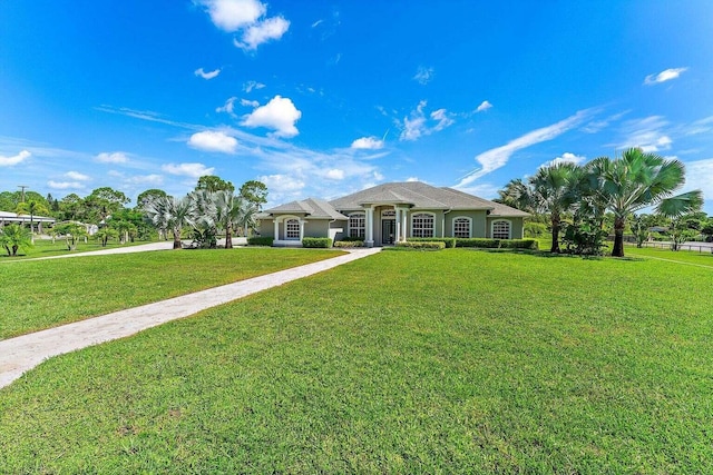 single story home featuring a front yard