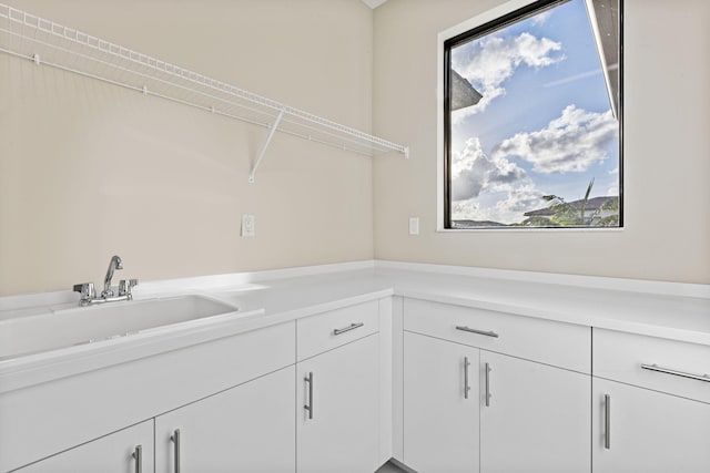 laundry room with a wealth of natural light and sink