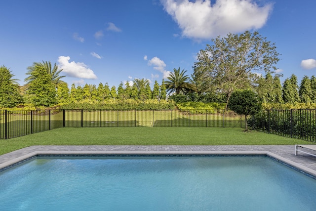 view of pool featuring a yard