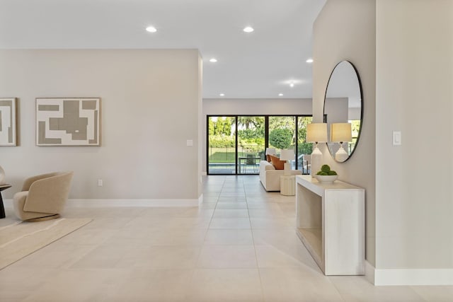 hall featuring light tile patterned floors