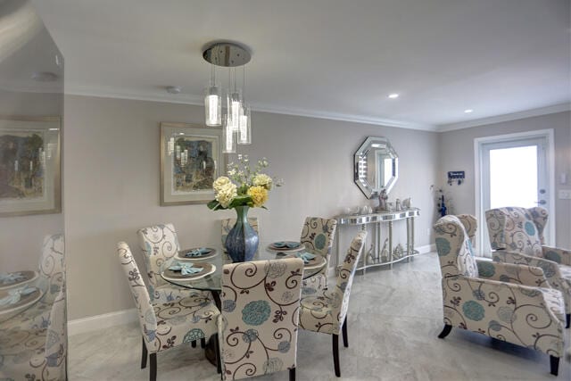 dining room featuring ornamental molding