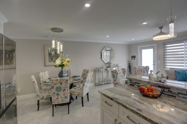 dining room featuring ornamental molding