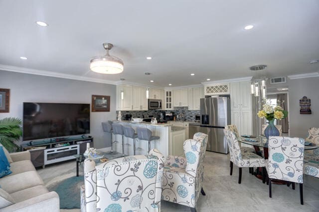 living room with ornamental molding