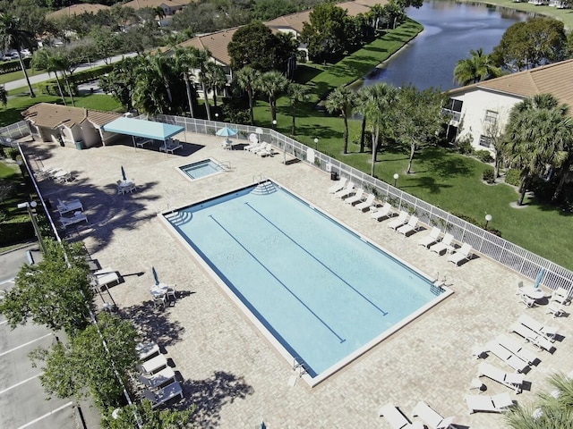 view of swimming pool featuring a water view