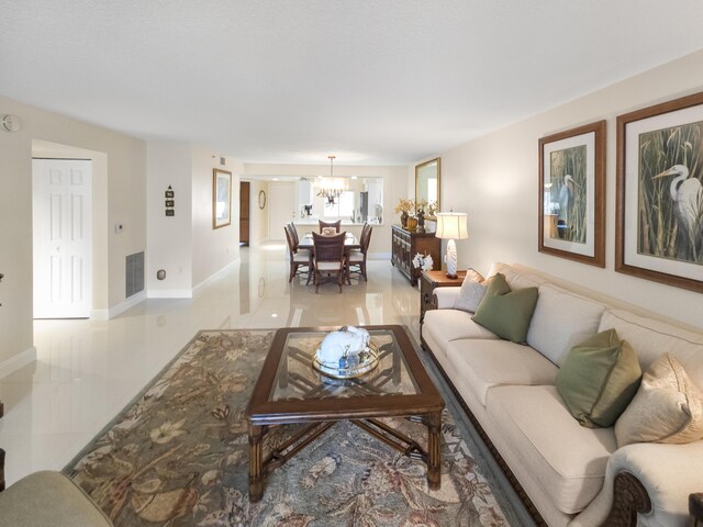 living room featuring light tile patterned floors and ceiling fan