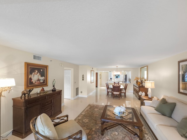 living room featuring a notable chandelier