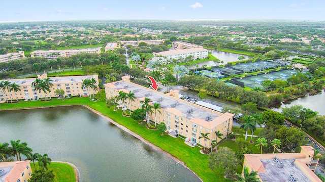 birds eye view of property featuring a water view