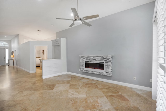 unfurnished living room with a fireplace, vaulted ceiling, and ceiling fan