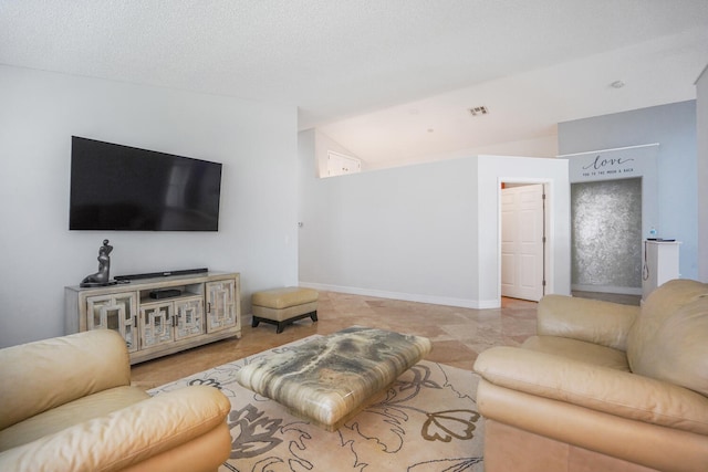 tiled living room with a textured ceiling and vaulted ceiling