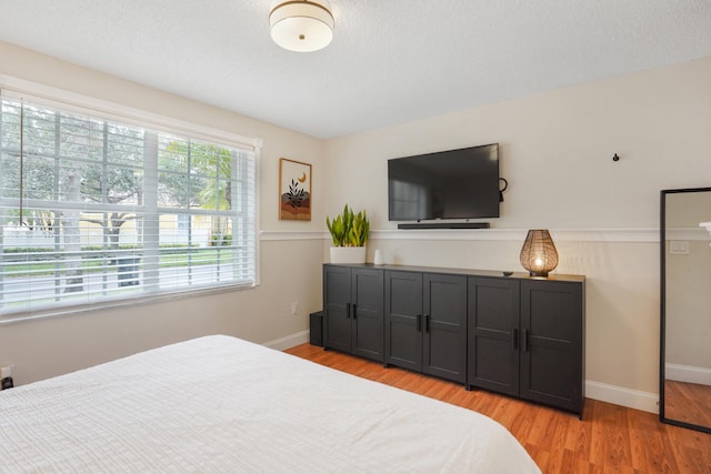 bedroom with light wood-type flooring