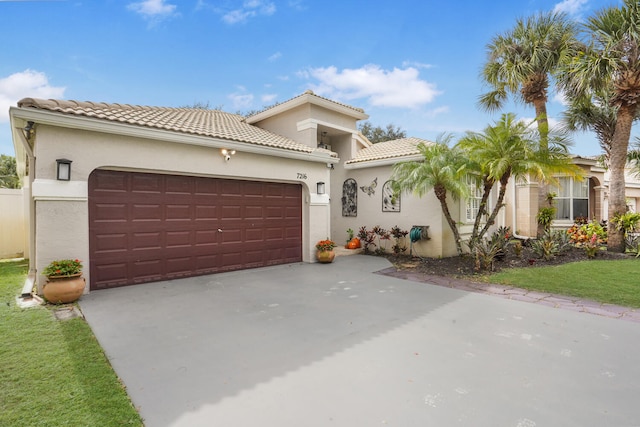 mediterranean / spanish house with a garage