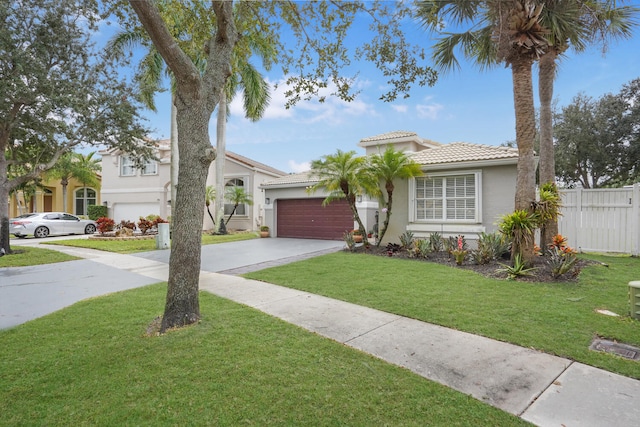 view of front facade featuring a garage and a front lawn