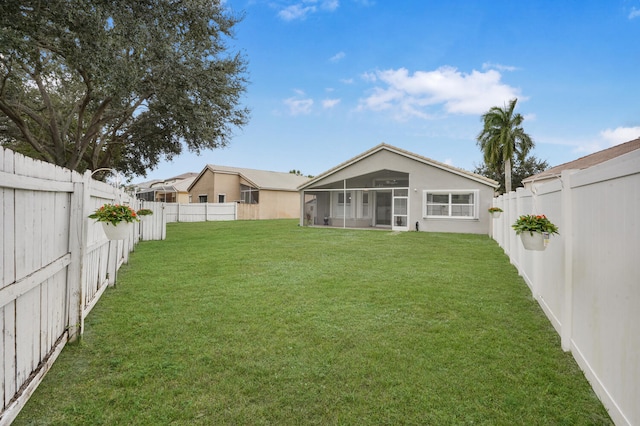 view of yard with a sunroom