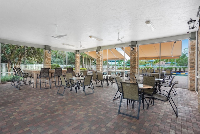 view of patio / terrace featuring ceiling fan