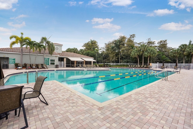 view of swimming pool featuring a patio area