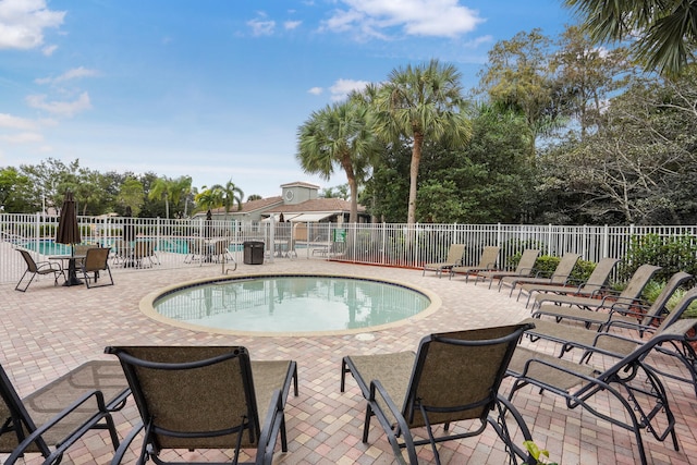 view of swimming pool featuring a patio