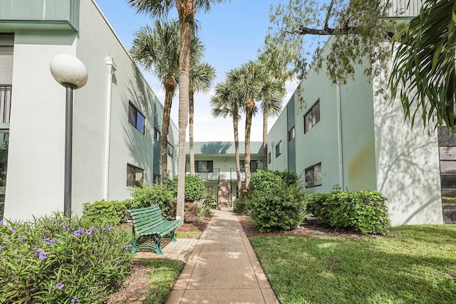 view of home's community featuring a yard