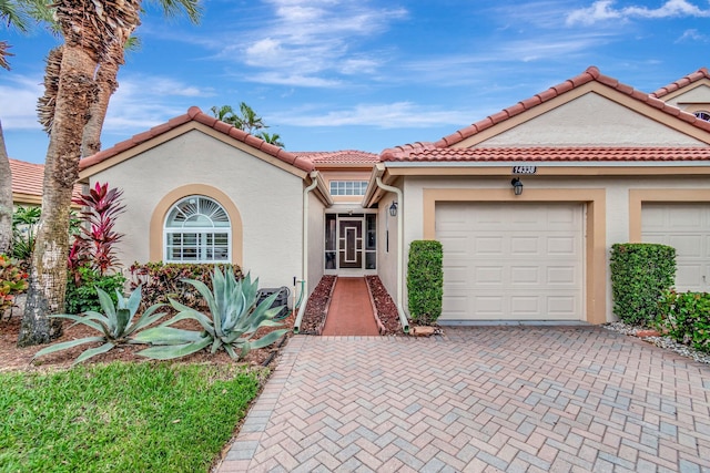 mediterranean / spanish-style home featuring a garage