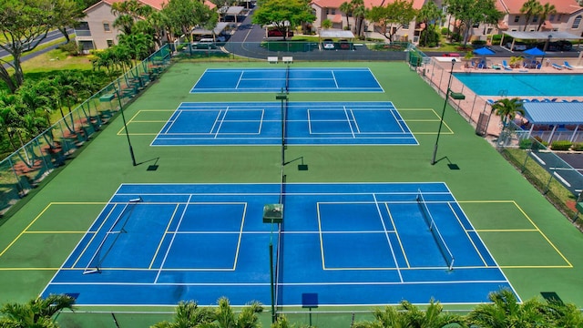 view of tennis court featuring basketball court