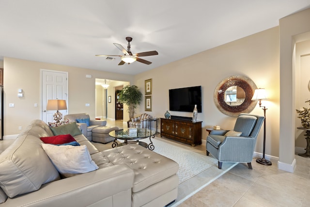 tiled living room featuring ceiling fan