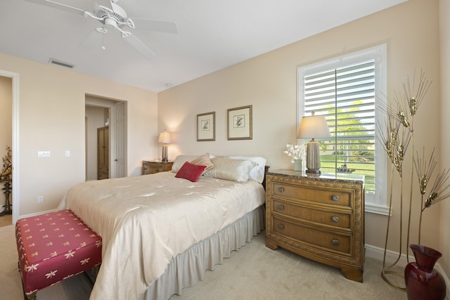 bedroom featuring light carpet and ceiling fan