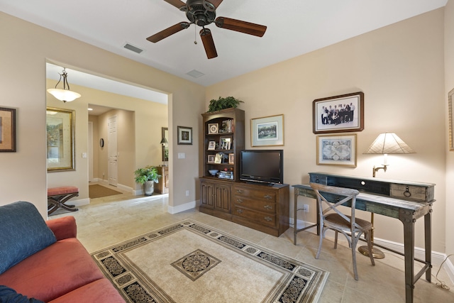 tiled office featuring ceiling fan