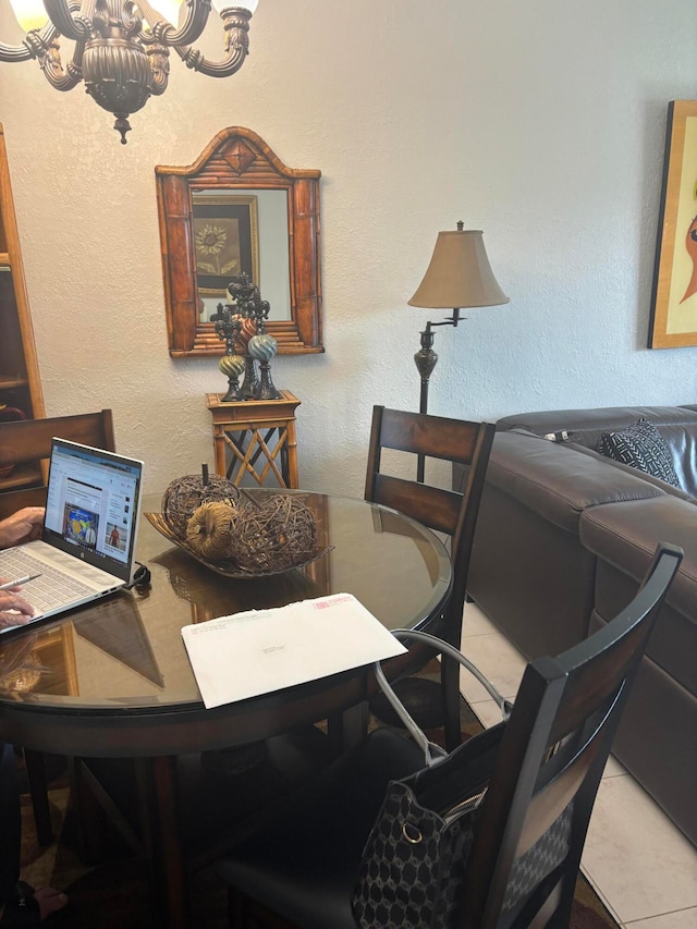 tiled office featuring a notable chandelier