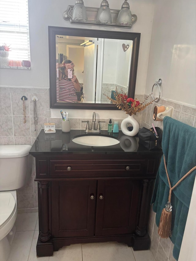 bathroom featuring tile walls, tile patterned flooring, vanity, and toilet