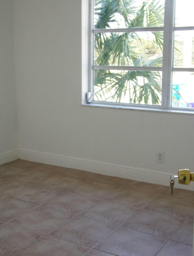 view of tiled spare room