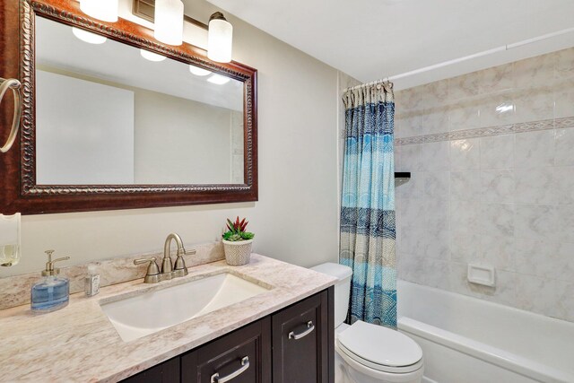 full bathroom with vanity, toilet, and shower / bathtub combination with curtain