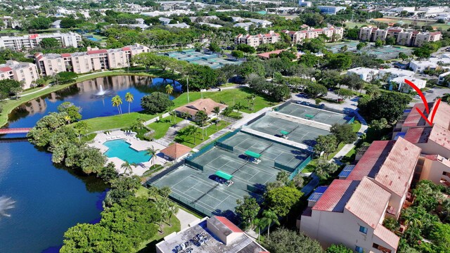 birds eye view of property with a water view