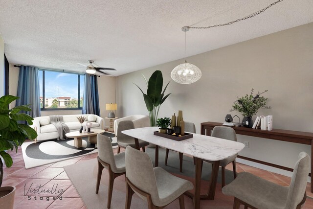 dining room featuring light tile patterned floors, a textured ceiling, and ceiling fan