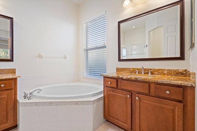 bathroom featuring vanity and shower with separate bathtub