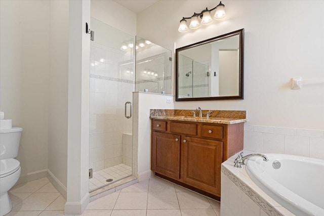 full bathroom featuring tile patterned floors, separate shower and tub, vanity, and toilet