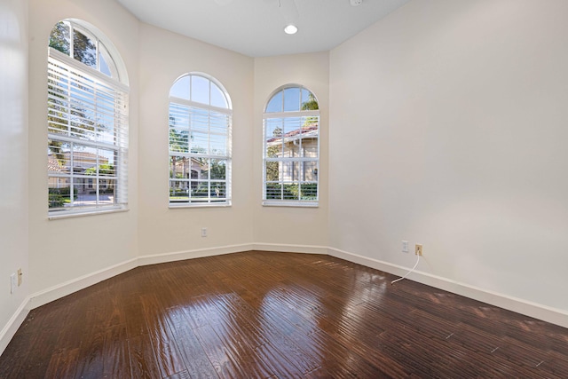 spare room with hardwood / wood-style flooring