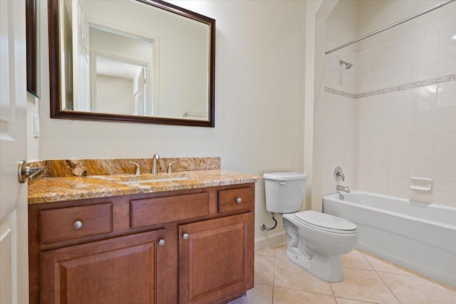 full bathroom featuring toilet, vanity, tile patterned floors, and tiled shower / bath combo